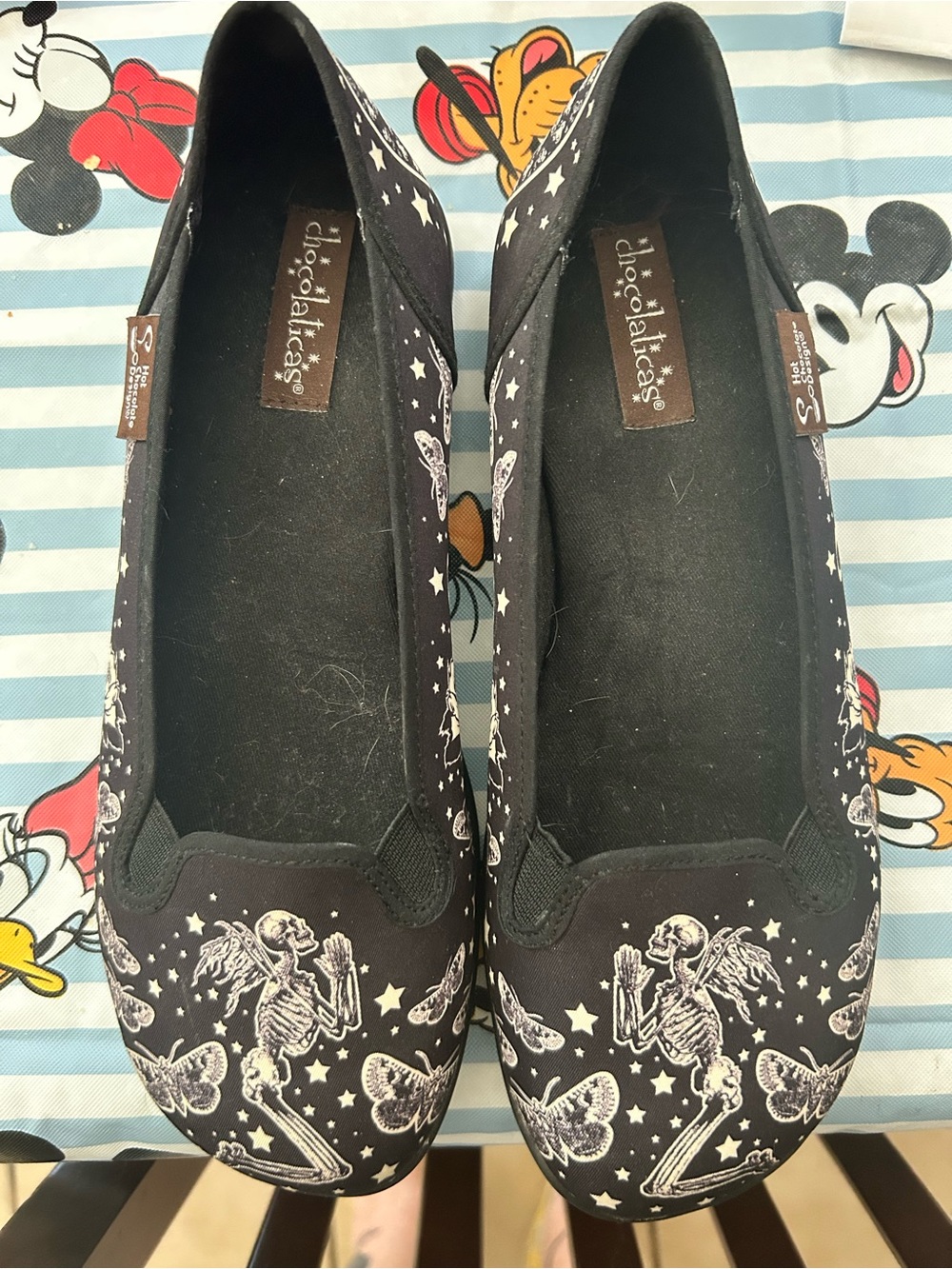 Hot Chocolate Black Slip-On Flats with Skeleton & Butterfly Print